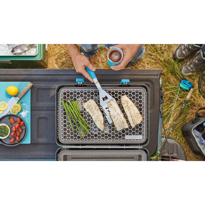 NOMAD Grill & Smoker 28-pound portable aluminum, blue in use for fall grilling fish and asparagus